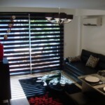 Living room with blinds partially closed Living room with blinds partially closed